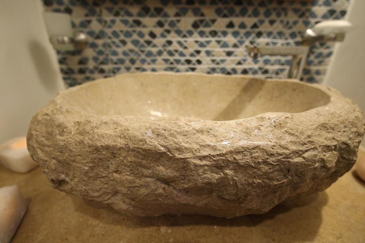 Benben By Dhara Hotels - Adults Only Aswan Bagian luar foto A stone sink